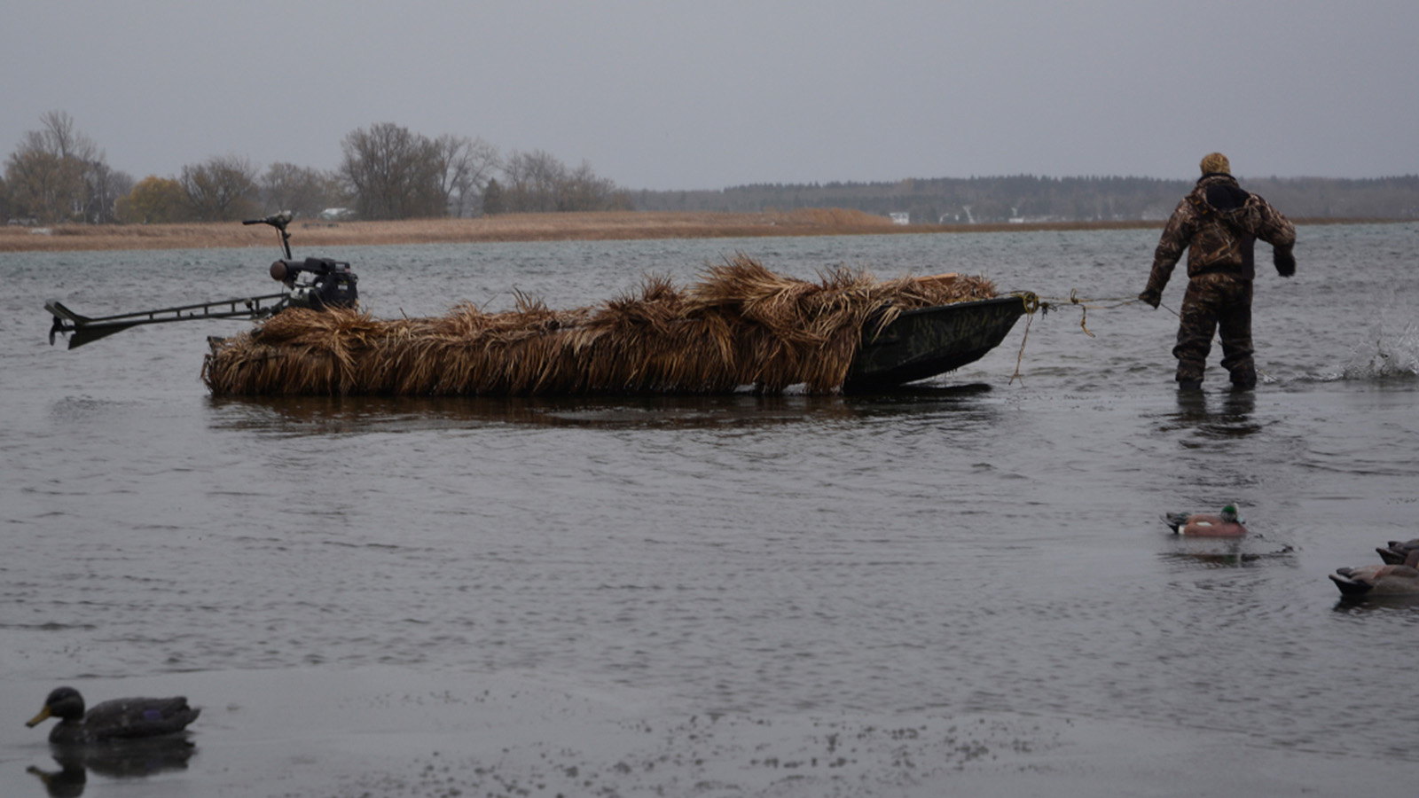 Waterfowl hunting with duck blind boat