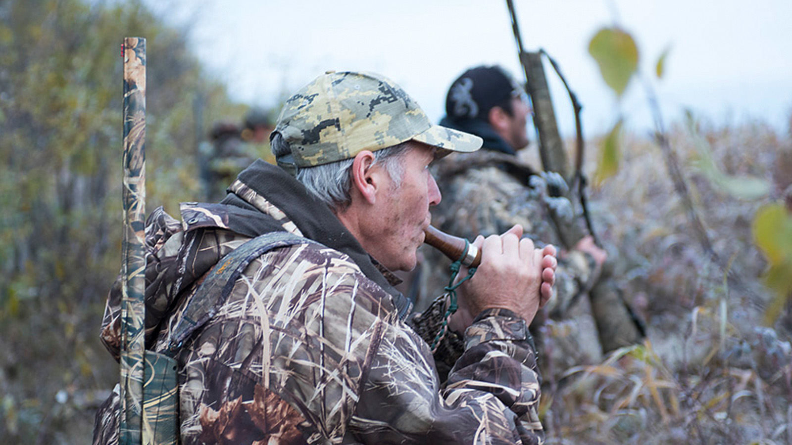 Waterfowl hunter calling during a hunt